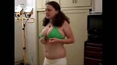 round lady tries on swimsuit