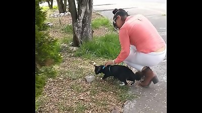 Meche Candela In leggings With Camellito walking Her kitten